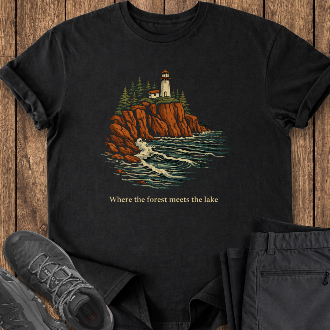 Black t-shirt with a lighthouse design on a wooden surface lake superior north shore hiking