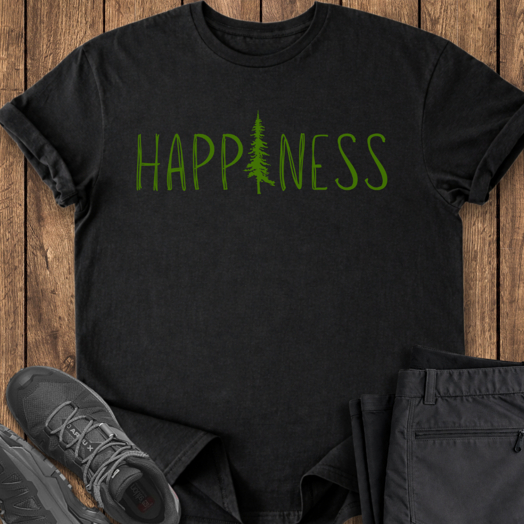 Black t-shirt with 'HAPPINESS' printed in green on a wooden surface with shoes and pants.