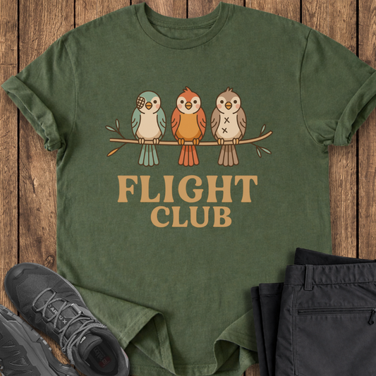 Green t-shirt with 'Flight Club' design featuring birds on a wooden surface with shoes and pants.