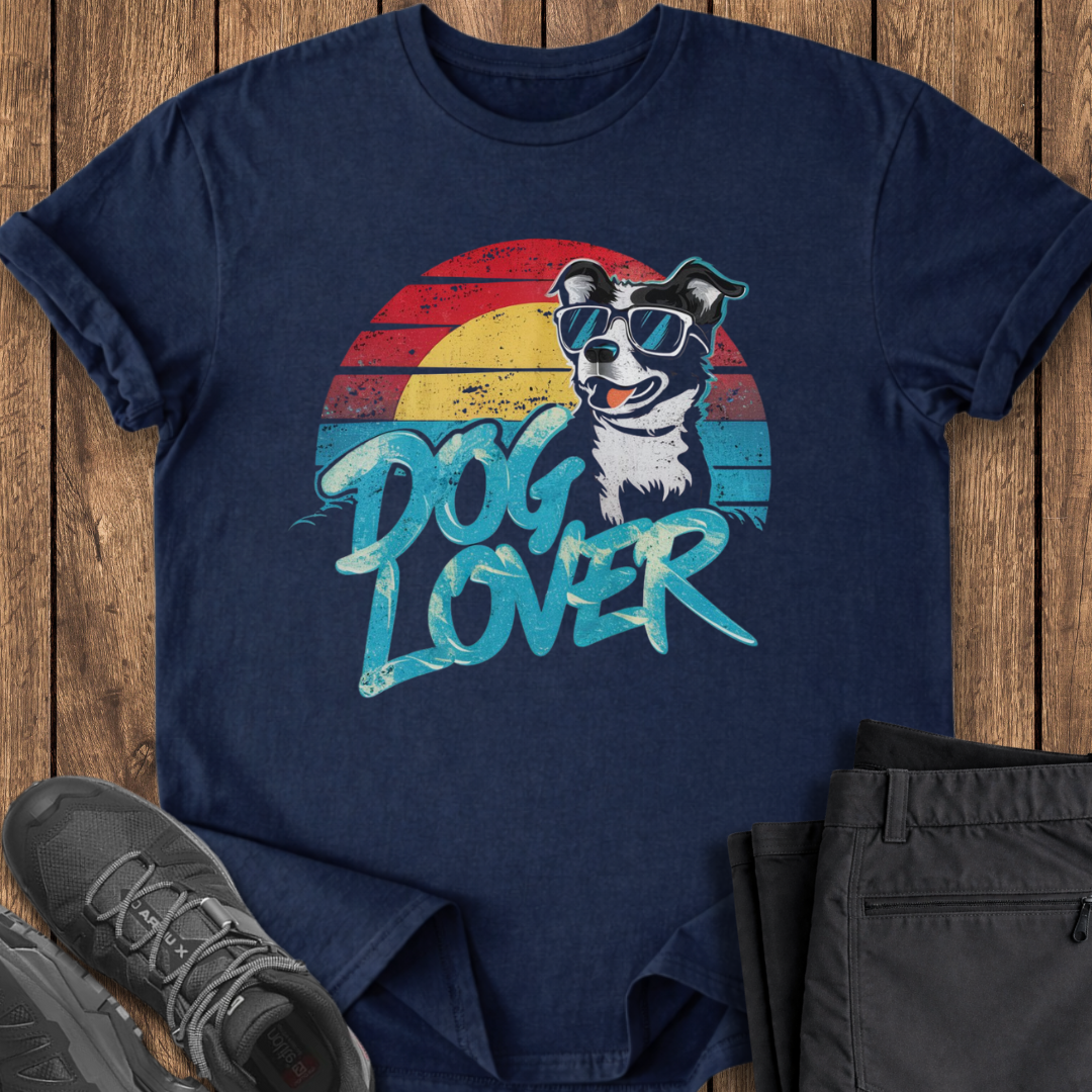 Navy blue t-shirt with dog graphic and 'Dog Lover' text on a wooden surface.