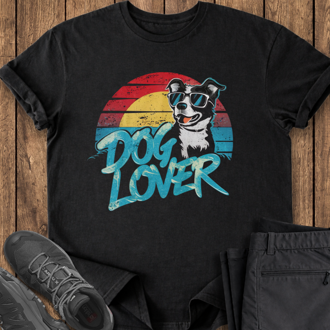 Black t-shirt with a dog graphic and 'Dog Lover' text on a wooden surface.