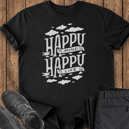 Black t-shirt with 'Happy Mind Happy Life' text on a wooden surface with shoes and pants.