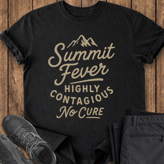 Black t-shirt with 'Summit Fever Highly Contagious No Cure' text on a wooden surface with shoes and pants. funny mountaineering hiking t shirt