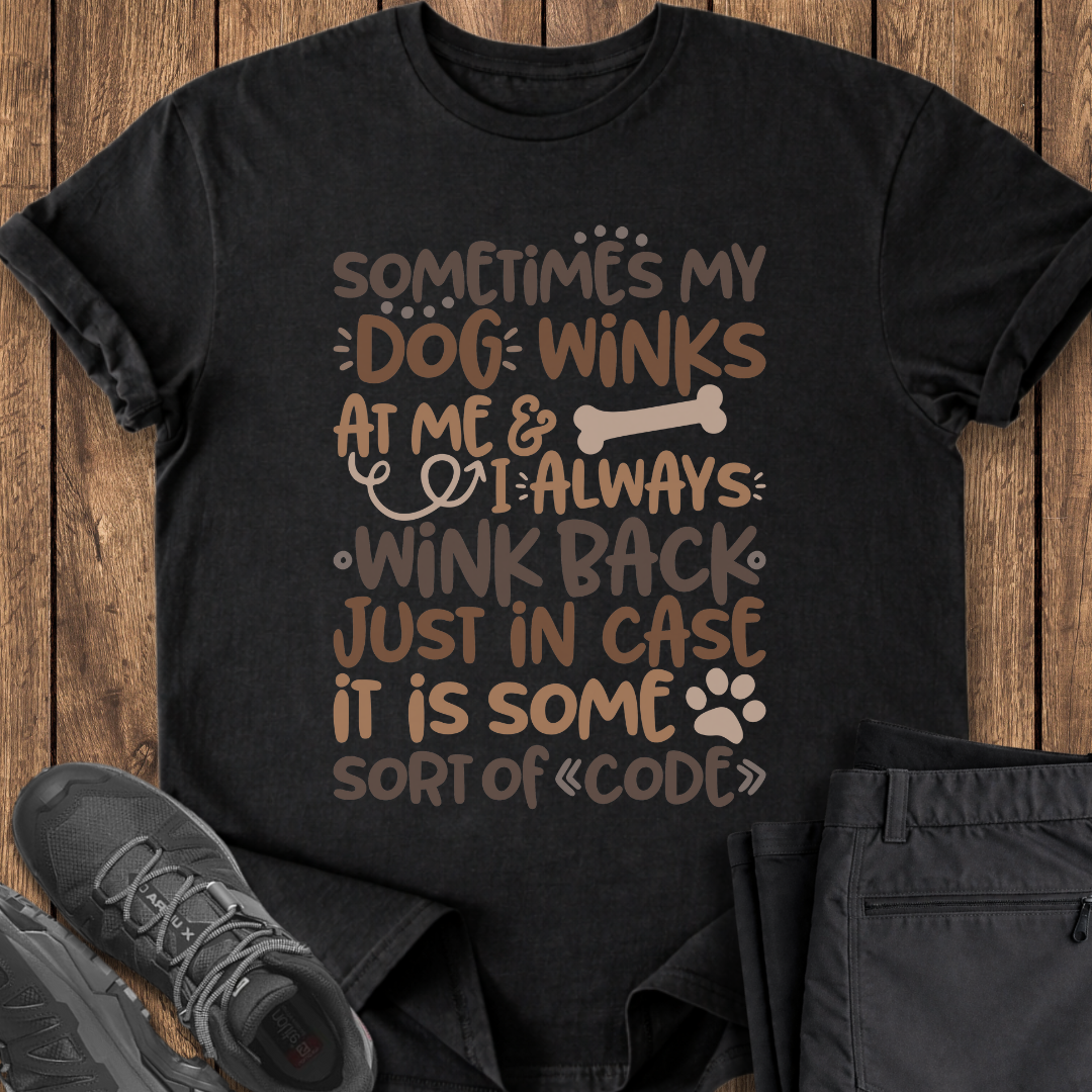 Black t-shirt with humorous dog-themed text on a wooden surface with shoes and pants. funny dog lover cute t shirt