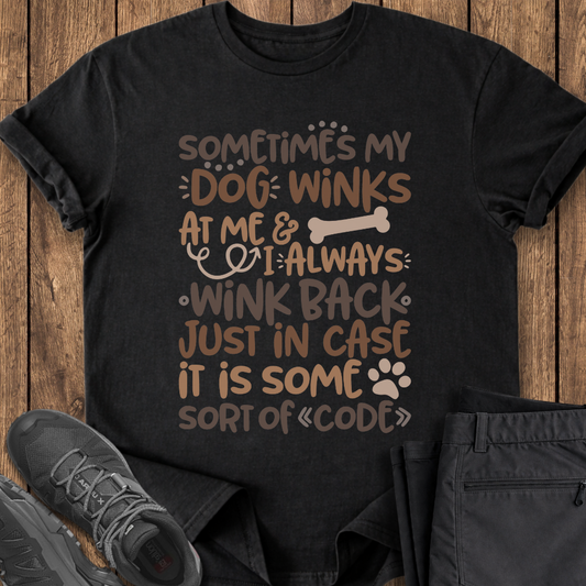 Black t-shirt with humorous dog-themed text on a wooden surface with shoes and pants. funny dog lover cute t shirt