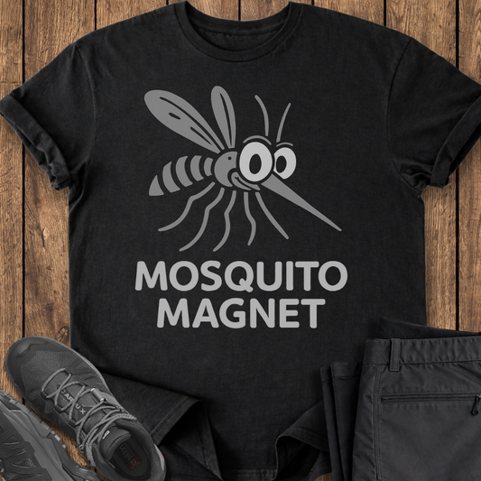 Black t-shirt with mosquito graphic and 'Mosquito Magnet' text on a wooden surface.