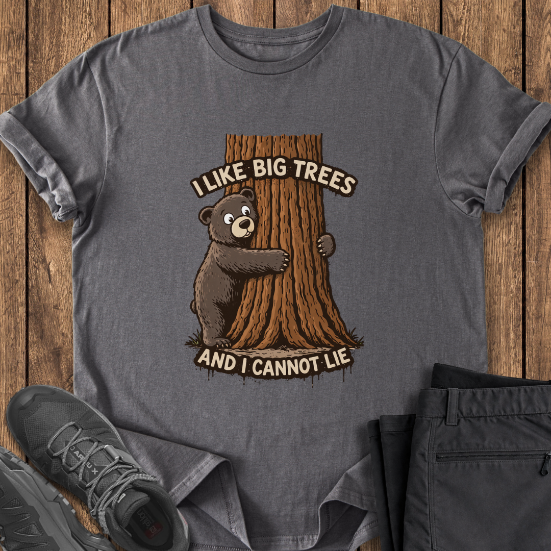 Gray t-shirt with bear and tree graphic and text 'I Like Big Trees and I Cannot Lie' on a wooden surface. cute funny tree hugger t shirt