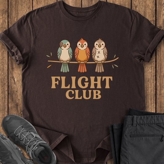 Brown t-shirt with 'FLIGHT CLUB' design featuring birds on a wooden surface.