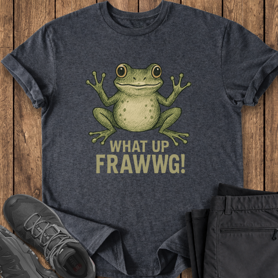 Dark gray t-shirt with a green frog graphic and text 'WHAT UP FRAWWG!' on a wooden surface.