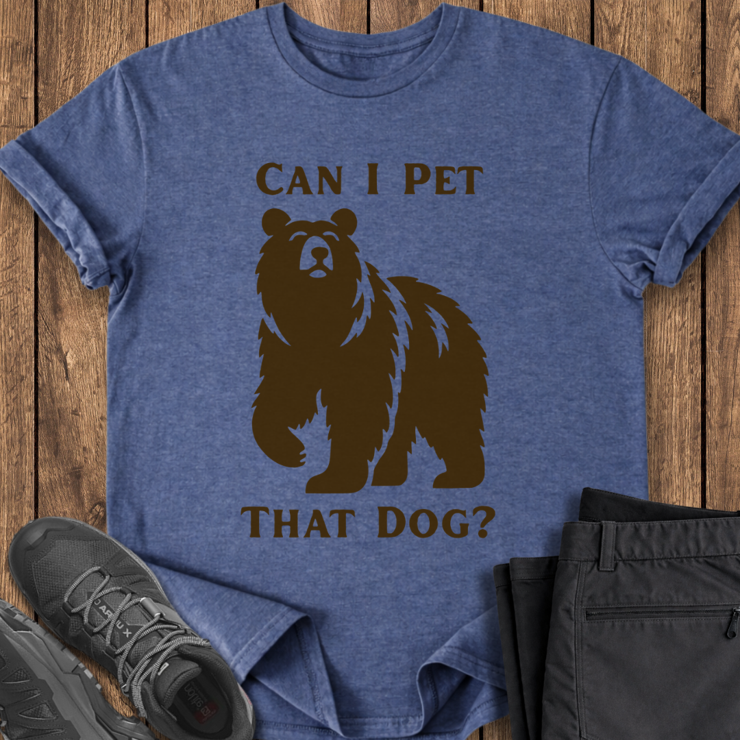 Blue t-shirt with bear graphic and text on a wooden surface with shoes and pants. funny viral funny shirt