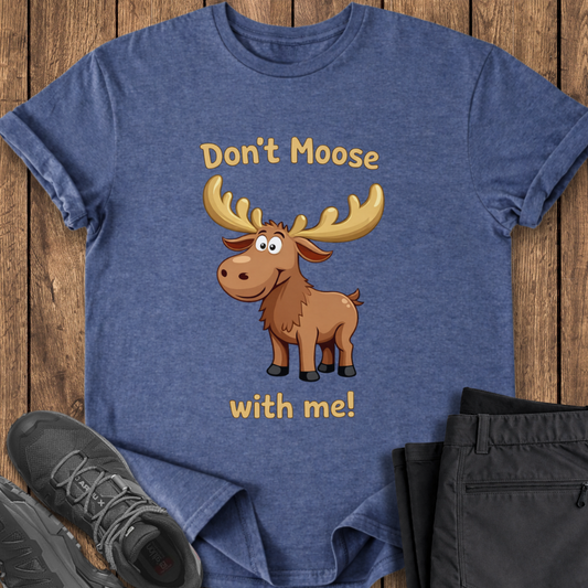 Blue t-shirt with a moose graphic and text on a wooden surface, surrounded by shoes and pants. funny dad joke t shirt