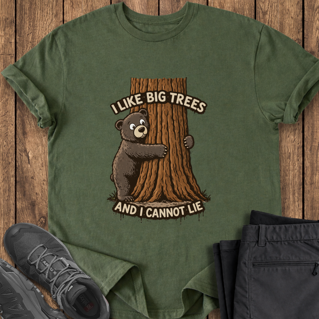 Green t-shirt with bear and tree design on a wooden surface with shoes and pants. funny tree hugger t shirt