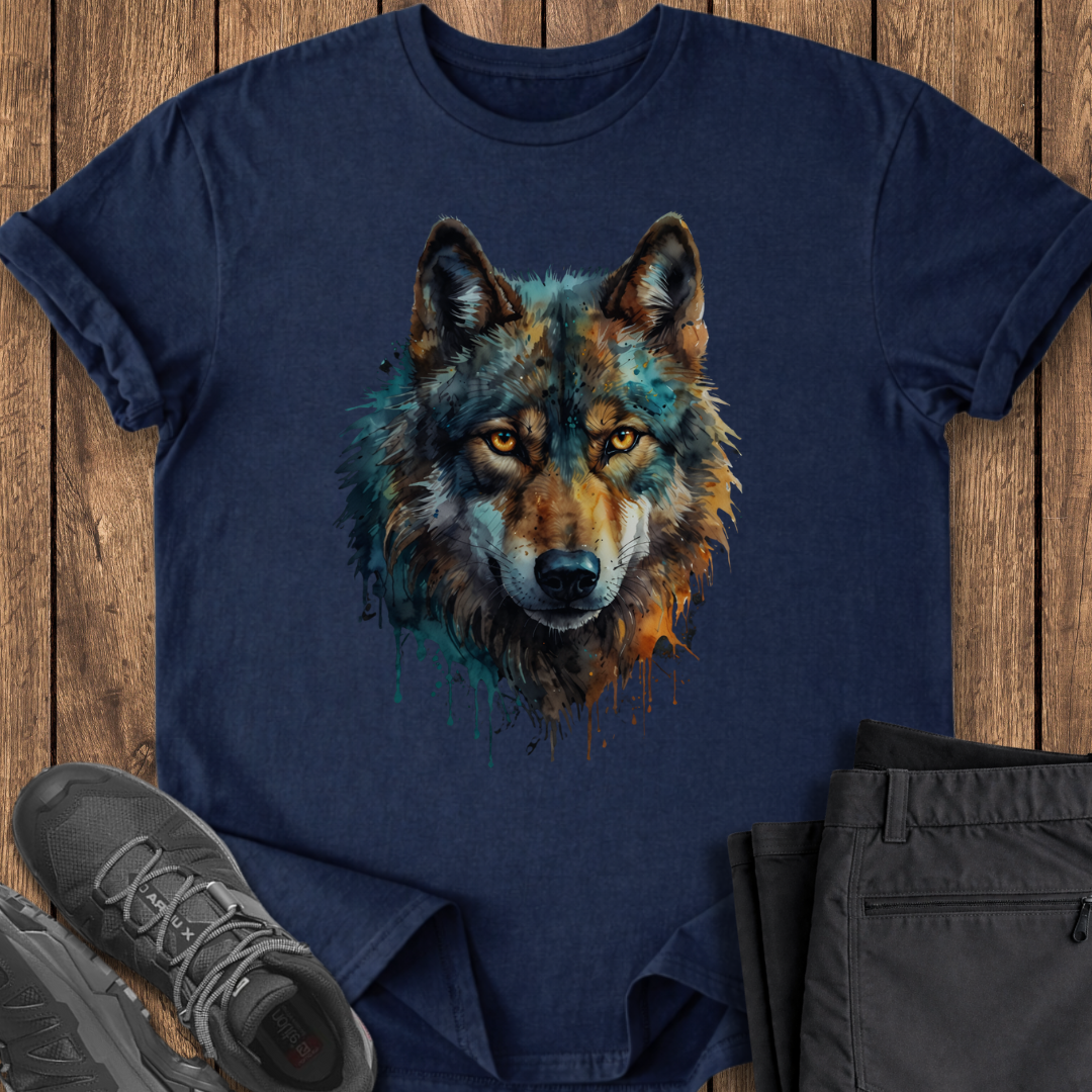 Navy blue t-shirt with a wolf graphic on a wooden surface with shoes and pants.
