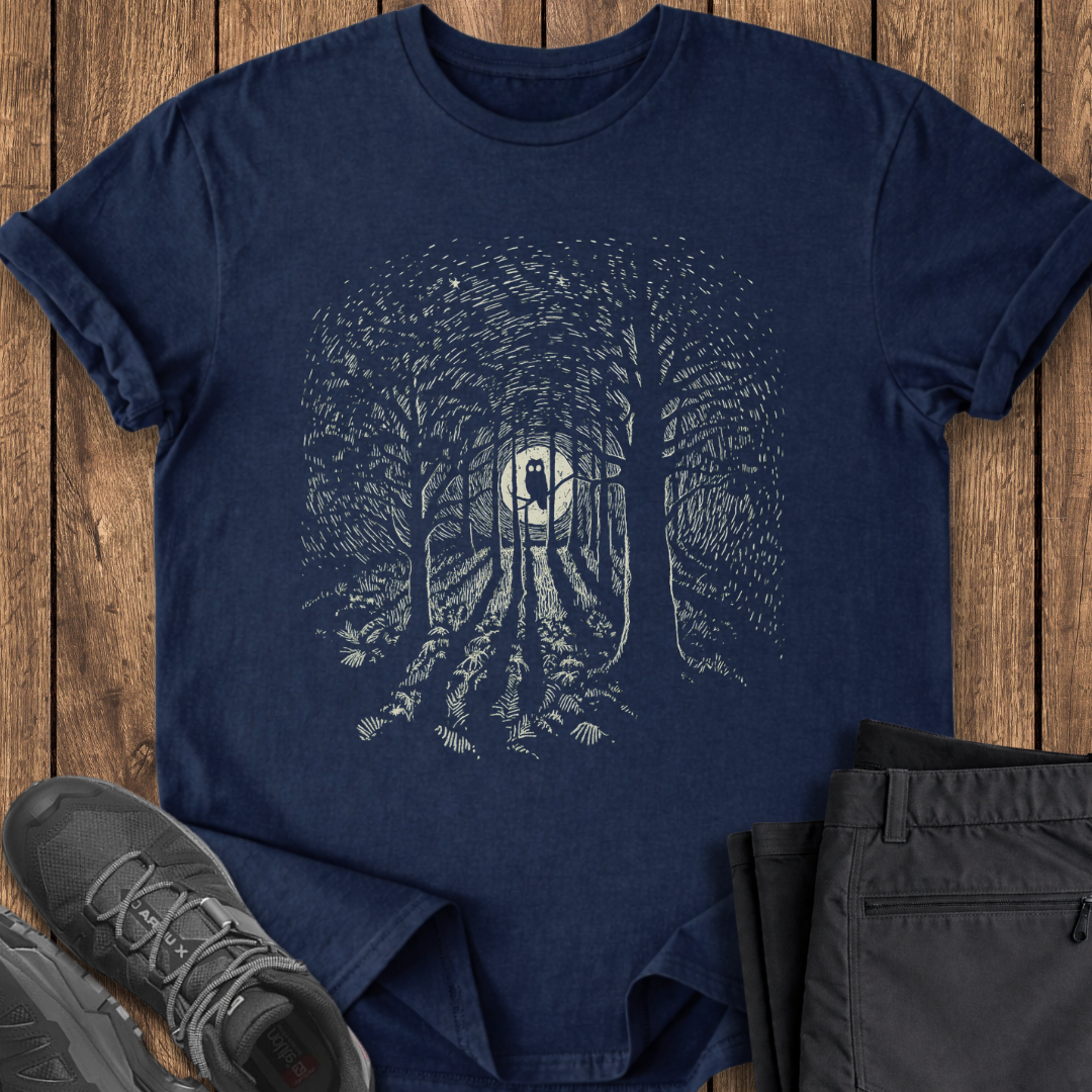Navy blue t-shirt with forest design on a wooden surface with shoes and pants. owl owling night t shirt birding