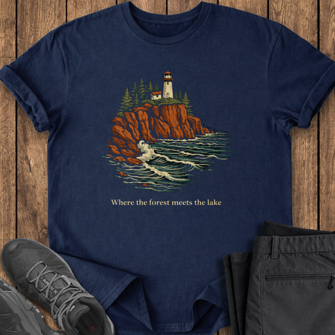 Navy blue t-shirt with a lighthouse design on a wooden surface north shore lake superior hiking shirt