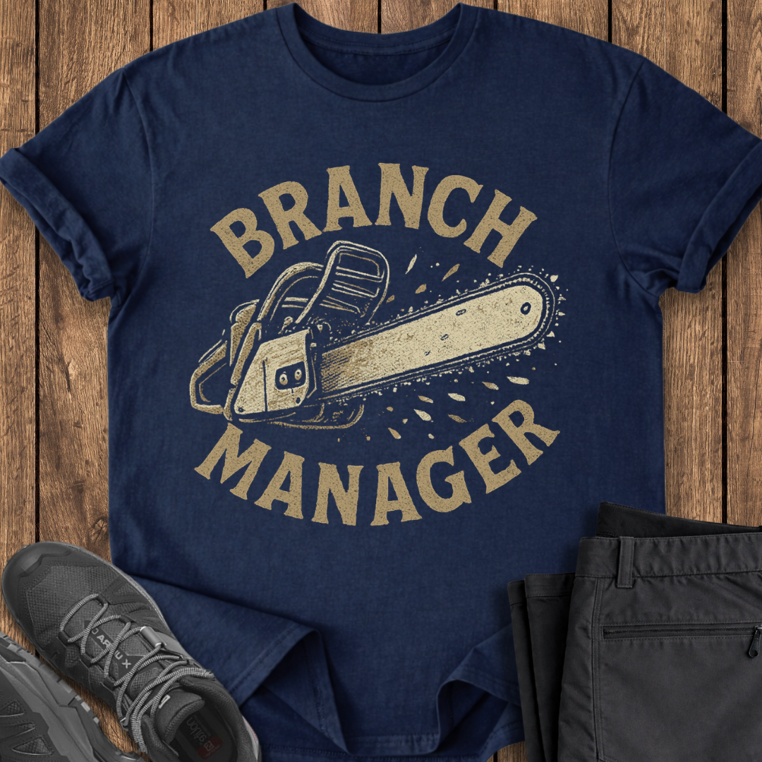Navy blue t-shirt with 'Branch Manager' graphic on a wooden surface with shoes and pants. funny camping chainsaw t shirt