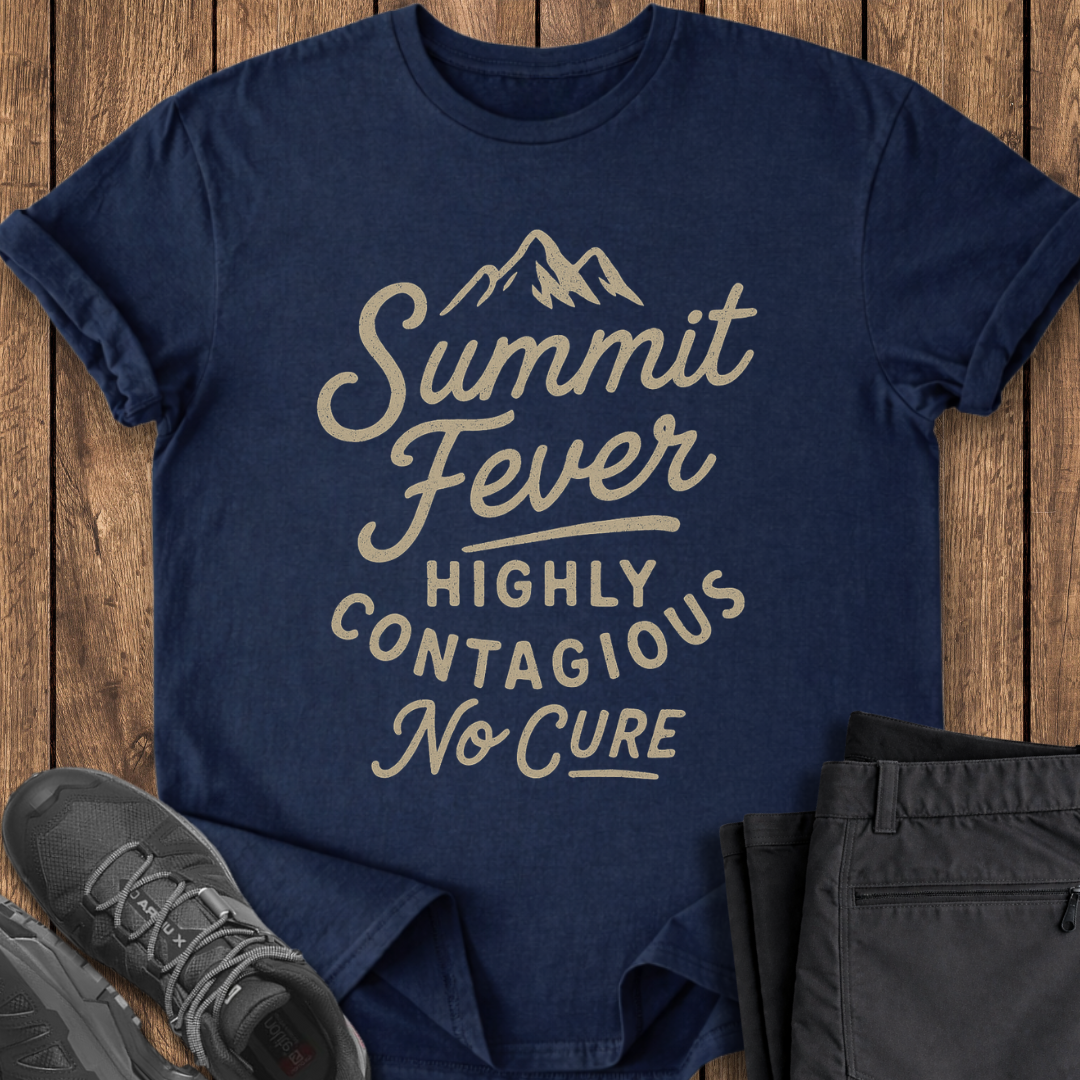 Navy blue t-shirt with 'Summit Fever Highly Contagious No Cure' text on a wooden surface, with shoes and pants for scale. funny climbing exploring t shirt