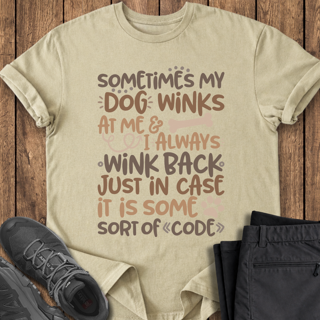 Beige t-shirt with humorous text design on a wooden surface with shoes and pants. funny dog shirt