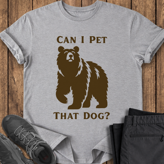 Gray t-shirt with bear graphic and text on a wooden surface with shoes and pants. funny viral t shirt