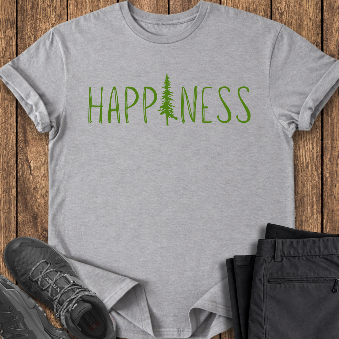 Gray t-shirt with 'HAPPINESS' and a tree graphic on a wooden surface with shoes and pants.